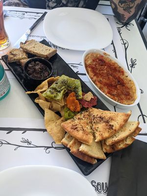 Local pittas with olive dip, and a bowl of aubergine dip on the right at Tis Mammis Sou in Rhodes