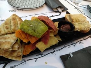 Bread, pita bread and fried slices of vegetable flavored flour and olive paste at Tis Mammis Sou in Rhodes
