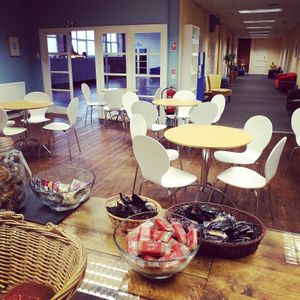 A view of our Cafe, Hall for rent and corridor with our comfy sofa's, perfect for a coffee while you read. at The Happy Yak Cafe in Leeds
