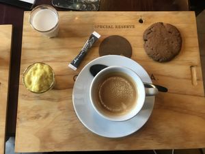 Coffee, chocolate chip cookie, avocado “custard” and vegetable milk at Atelier Flori in Bruges