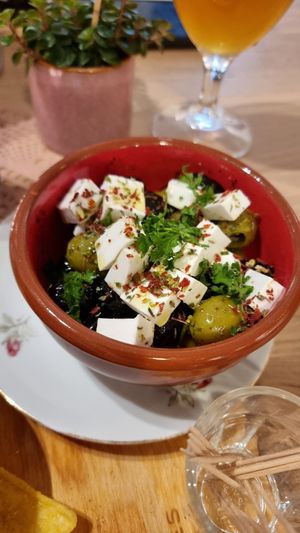 Olives with vegan cheese at Atelier Flori in Bruges