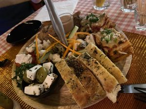 Foccacia, olives with violife feta, homemade vegan cheeses and pâté at Atelier Flori in Bruges