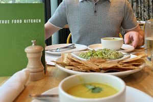 Summer Corn Soup & Edamame Guacamole   at True Food Kitchen in New Orleans