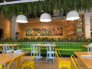 Interior is gorgeous. The sign on the wall reads Eat more color (obviously meaning veggies) at True Food Kitchen in New Orleans
