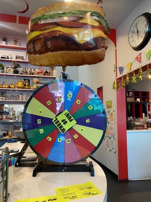 Wheel of prizes for anniversary celebration!  at DC Vegetarian in Portland