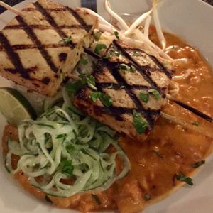 Vegan option of the dinner special at Nine Mile West tonight: Grilled tofu skewers, with mango, peppers, and onion in a Sriracha coconut sauce; served with rice, and finished with cilantro, bean sprouts, and a cucumber salad.  at Nine Mile Montford in Asheville