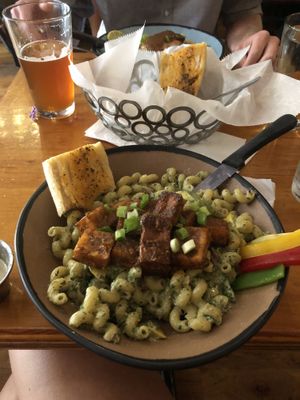 Veggie pesto with tofu!! Amazing garlic tahini salad dressing (already ate) 😍 at Nine Mile Montford in Asheville