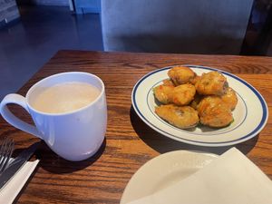 Oatmilk Carmel latte and the crispy brussel sprouts   at Cafe Sunflower in Atlanta
