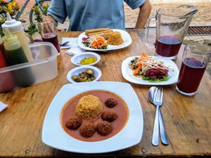 Mexican rice with chickpea dumplings, salad and fried tortilla rolls at Falafel Shalom in Tepoztlan