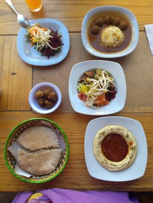 Hummus Matbuja, falafel, pita bread, salad at Falafel Shalom in Tepoztlan
