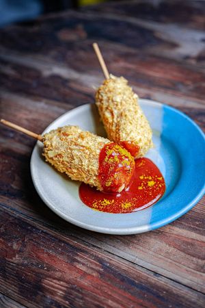 Currywurst im Pommesmantel at Alex & Casi's Knast in Braunschweig