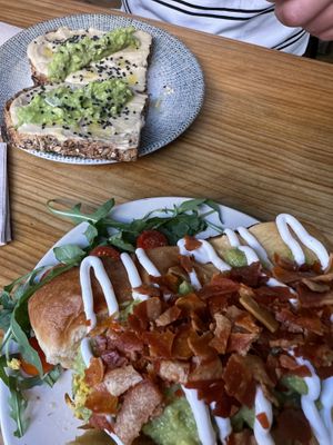 Back : Hummus and Avocado | Front : Brioche with scrambled eggs, avocado, sour cream and bacon bites! totally vegan…  at Frutas Prohibidas in Madrid