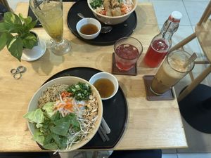 Noodle salad with tofu and mushrooms, hibiscus kombucha and coffee with condensed soy milk  at Nâunâu in Ho Chi Minh City