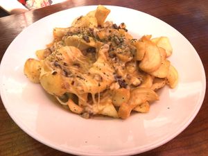 Vegan poutine: side-winder fries, mushroom gravy, and vegan cheese at Fernwood Bar & Grill in Big Sur