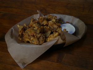 Wild 804 Cornmeal Beer Battered Wild Mushrooms ; shitake, oyster, and chanterelle.  at Fernwood Bar & Grill in Big Sur