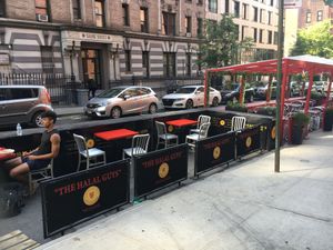 Outdoor seating at The Halal Guys in New York City