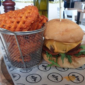 Vegan burger comes with sweet potato waffle fries at The Jolly Miller Cafe in Altona