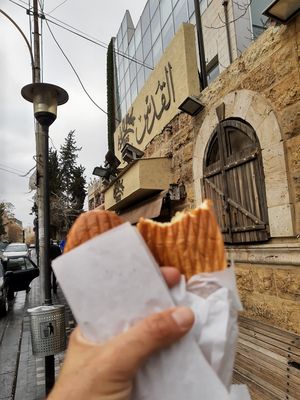 In front of the restaurant at Al Quds Falafel in Amman