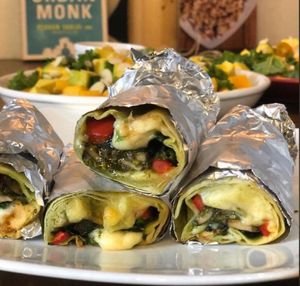 Grilled tortillas with spinach, mozzarella, garlic mushroom, bell pepper, sauteed tofu & homemade pesto sauce at Santorino Coffee & Veggies in Ho Chi Minh City