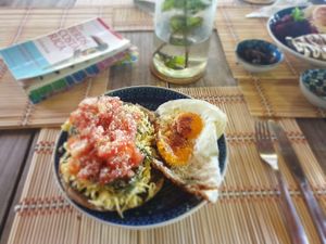 Avocado on homemade toast with eggs and homemade pesto  at Café Coral in Cahuita