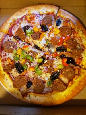 I ordered the Beyond Sausage pizza and I couldn't be more pleased. 😍 at T-Mama's Gourmet in Aurora