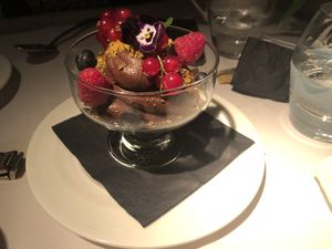 Indulgent avocado chocolate mousse with fresh berries. at Fellinis in Ambleside