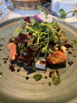 Baked fig, vegan goat cheese & pomegranate molasses salad  at Fellinis in Ambleside