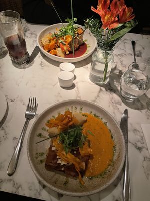 Top: Aubergine rolls, roasted vegetables, boulangerie potato and red wine sauce. Below: Roasted vegetables and almond baklava with harissa mash and red pepper sauce.  at Fellinis in Ambleside