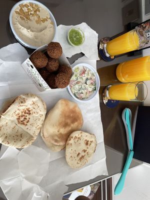 Take away falafel, hummus, pita and tahini salad   at Abu Jbara in Amman
