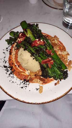Black garlic charred broccoli with olive mash and Romesco sauce at Glas Restaurant in Dublin