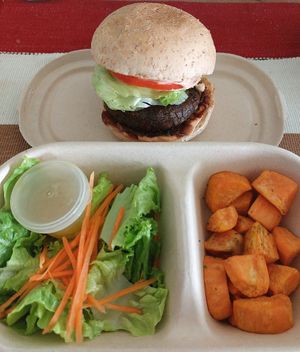 Vegan black bean burger with air fried sweet potatoes and side salad 😋 at iVegan in Makati