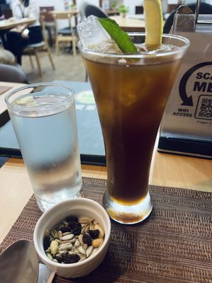 Complimentary nuts and water and then I bought an iced tea (very good)  at iVegan in Makati