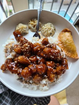 Sesame chicken, curry pockets, and steamed dumplings at Harmony Vegetarian in Chamblee