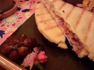 Vegan cheese toastie at Plush York, with their signature edible flowers (plus tomato and onion for an extra £1) at Plush in York