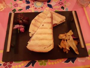 Vegan cheese toastie at Plush York, with their signature edible flowers at Plush in York