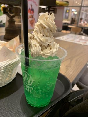 Melon soda float (ice cream covered with whip cream) at Futaba Fruits Parlor in Nagoya
