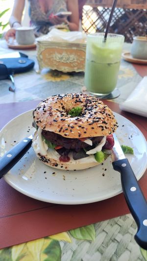 Plant base meat bagel with iced Matcha Latte at Apple Tree Cafe in Phuket
