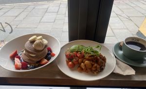 Banana pancakes, homemade beans, americano  at Rask in Derby