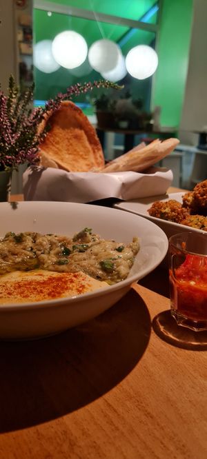 Aubergine 🍆 with hummus and falafel at Falafel Sababa in Berlin