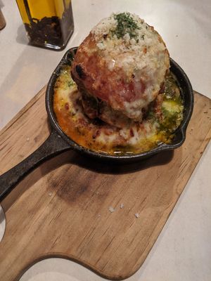Stacked avocado, tomato, and cheese baked in the pizza oven at Tierra in Osaka