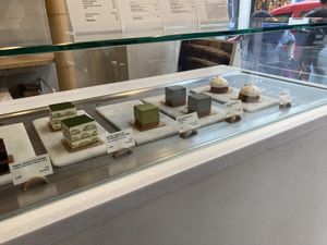 Display case with items - matcha tiramisu, black sesame cheesecake, citrus tart  at Soi & Co in Berlin