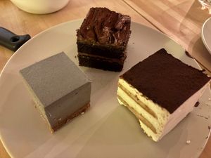 Black sesame cheesecake, chocolate cake, and tiramisu at Soi & Co in Berlin