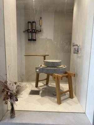 Tofu making tool (traditional looking of grinder of soaked bean) is displayed  at Soi & Co in Berlin