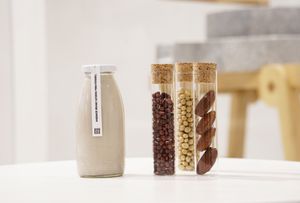 Our handmade organic soy milk flavored with adzuki beans and dates is prepared with the traditional chinesse way using hand-pulled stone mills keeping the flavour of soy to the gre at Soi & Co in Berlin
