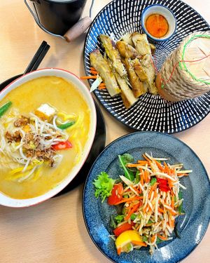 Laksa and papaya salad with chick’n and sticky rice, super good!  at Madame K's Vegan- CBD in Melbourne