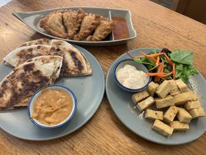 Entrees: curry puffs, roti, Japanese tofu  at Madame K's Vegan- CBD in Melbourne