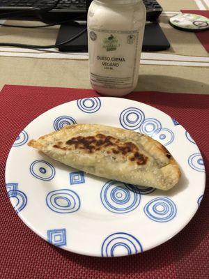 Empanada y queso crema vegano at Vegan For The Animals Food in Bogota