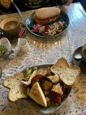 Vegan gf tofu & grilled veg salad (front), vegan sausage panini (back)  at Leila's Kitchen in Hebden Bridge
