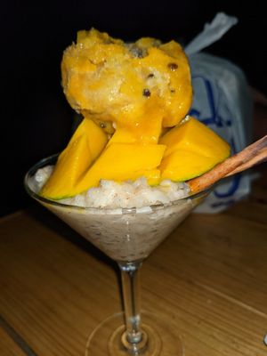 Coconut sticky rice. With passion fruit sorbet and 🥭. at Khalan Thai in Aguadilla