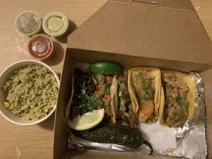 Taco platter with a side of cilantro corn rice at Cascabel in Houston